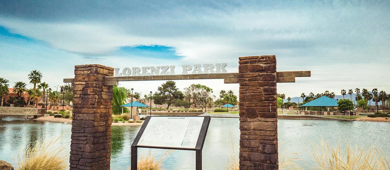 Lorenzi Park signage beside the lake