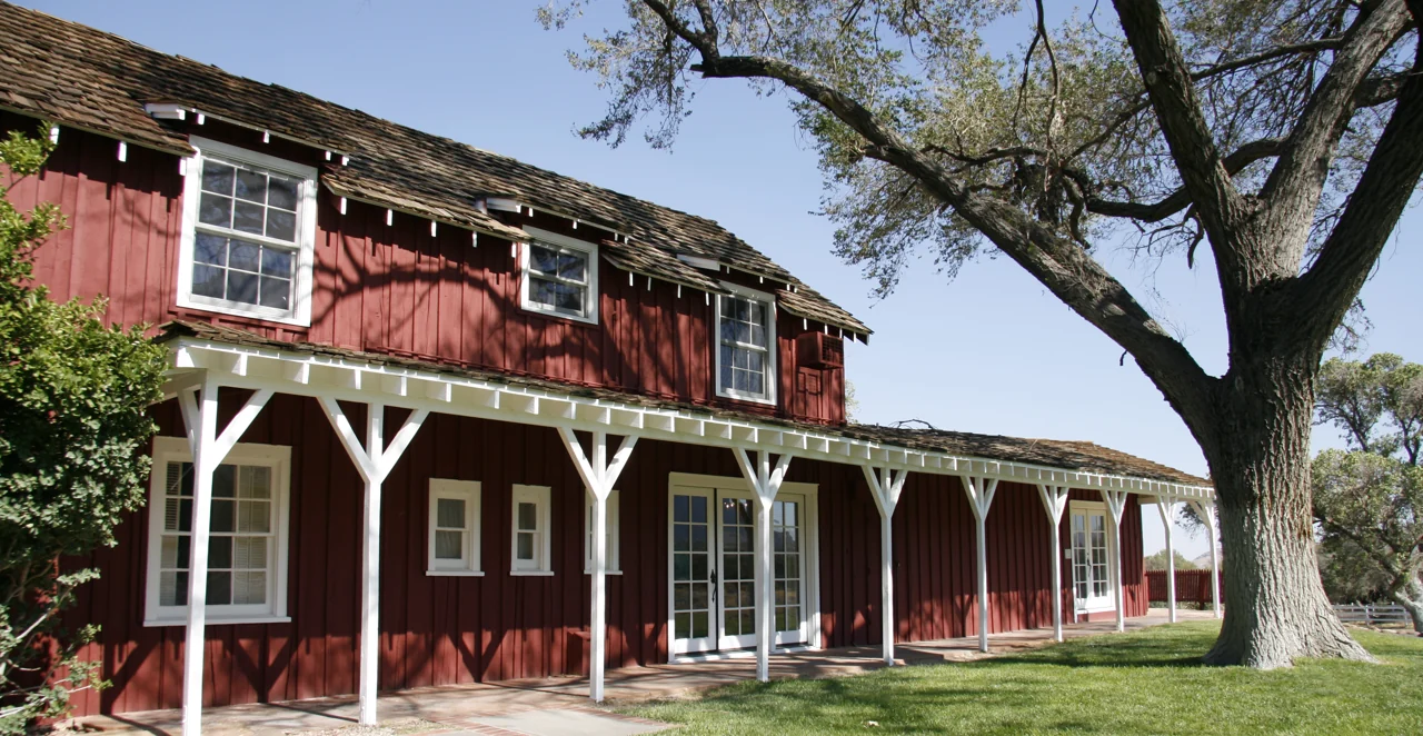 A red historic ranch building at Spring Mountain Ranch