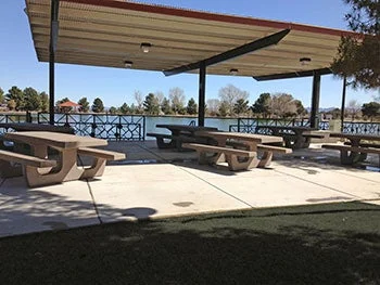 Picnic shelters beside the pond at Sunset Park